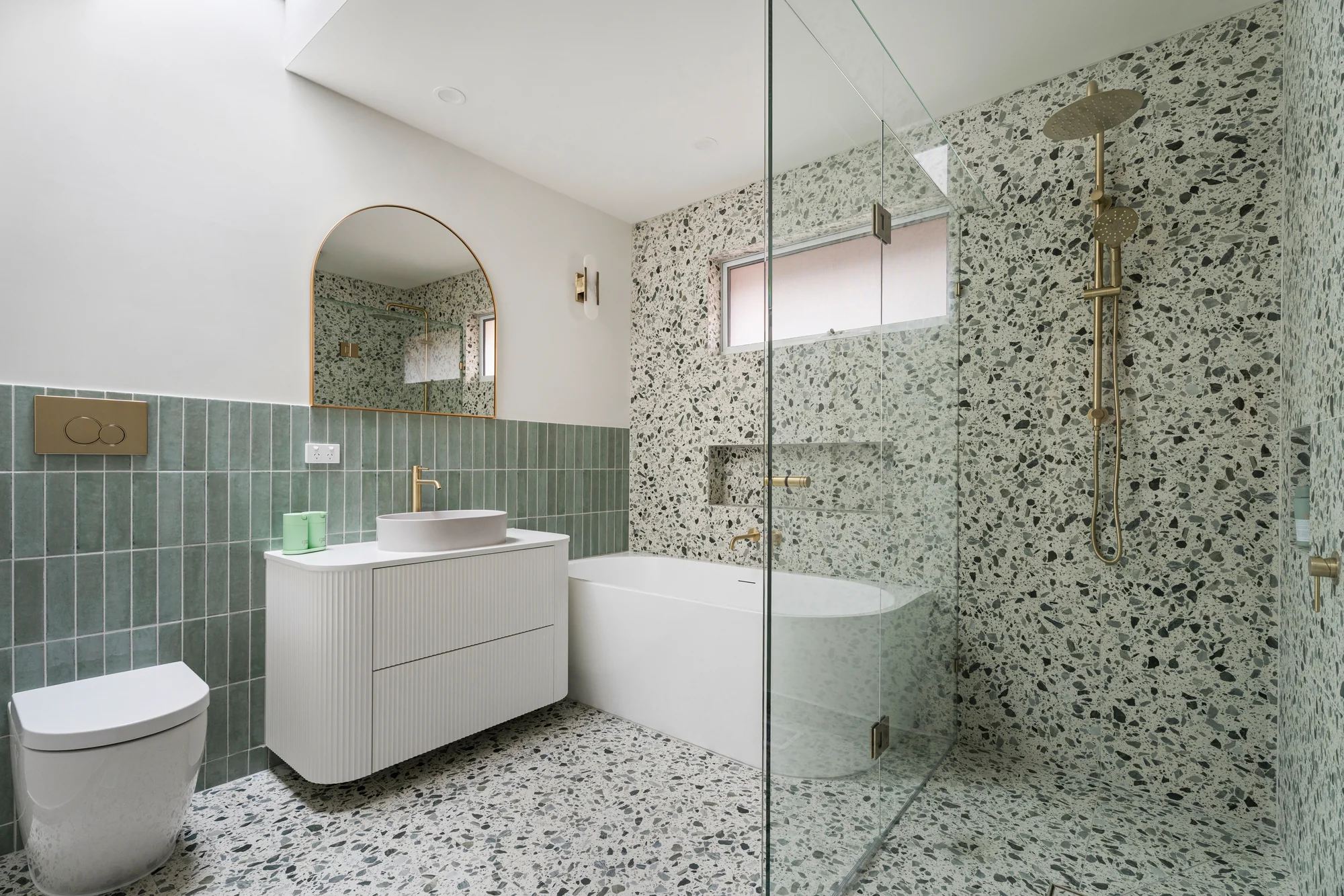 Green tiled and terrazzo bathroom completed by Ivory Built at 41 Tunaley Parade, Reservoir