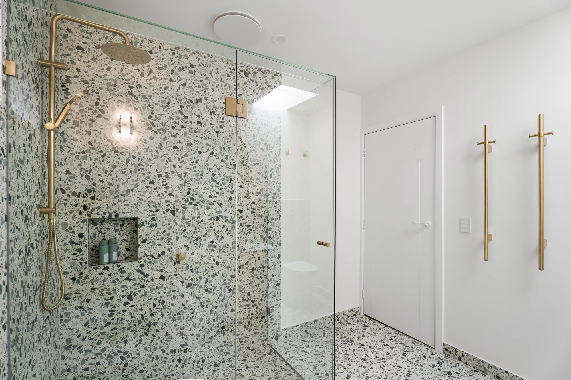 Terrazzo-lined shower with brass-framed mirror at 41 Tunaley Parade, Reservoir